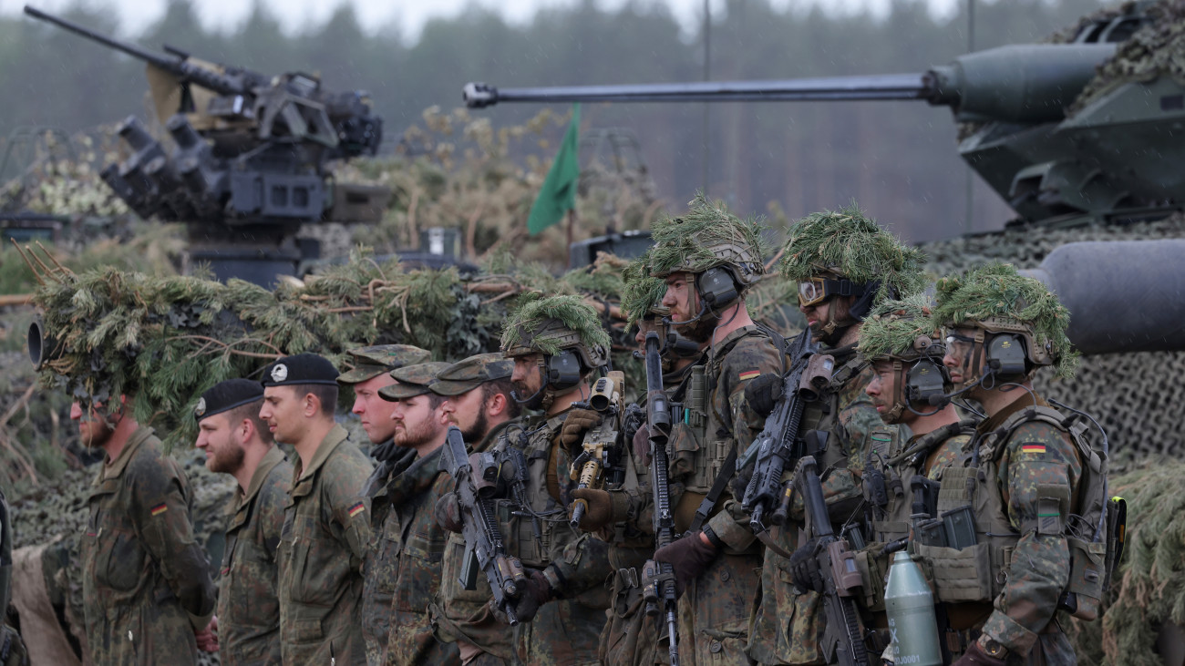 PABRADE, LITHUANIA - MAY 29: Troops of the Bundeswehr, the German armed forces, stand near their vehicles at the Quadriga military exercises involving German, French, Lithuanian and Dutch troops during a Distinguished Visitors Day on May 29, 2024 near Pabrade, Lithuania. Quadriga is the final part of Steadfast Defender, a series of military exercises of the NATO alliance that has been taking place mostly in northern and eastern Europe and has involved 90,000 troops with thousands of vehicles. (Photo by Sean Gallup/Getty Images)