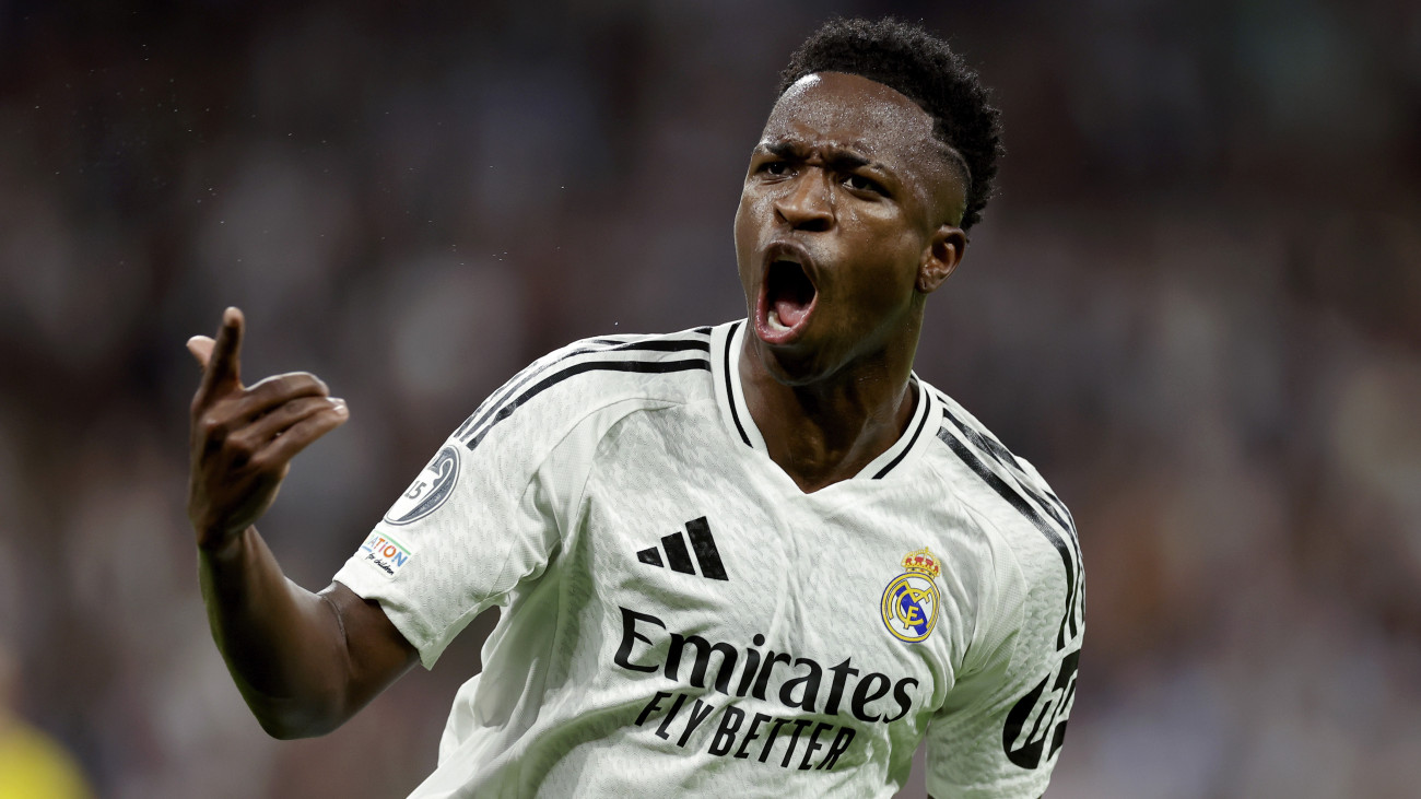 MADRID, SPAIN - OCTOBER 22: Vinicius Junior of Real Madrid celebrates 2-2 during the UEFA Champions League  match between Real Madrid v Borussia Dortmund at the Estadio Santiago Bernabeu on October 22, 2024 in Madrid Spain (Photo by Maria Gracia Jimenez/Soccrates/Getty Images)