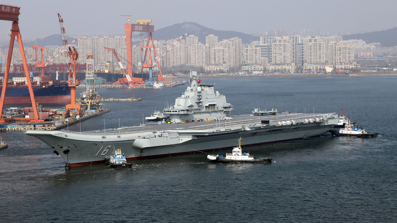 DALIAN, CHINA - FEBRUARY 29: Aircraft carrier Liaoning sets for sea trial at Dalian shipyard with the help of towboats after nearly one year of maintenance on February 29, 2024 in Dalian, Liaoning Province of China. (Photo by VCG/VCG via Getty Images)