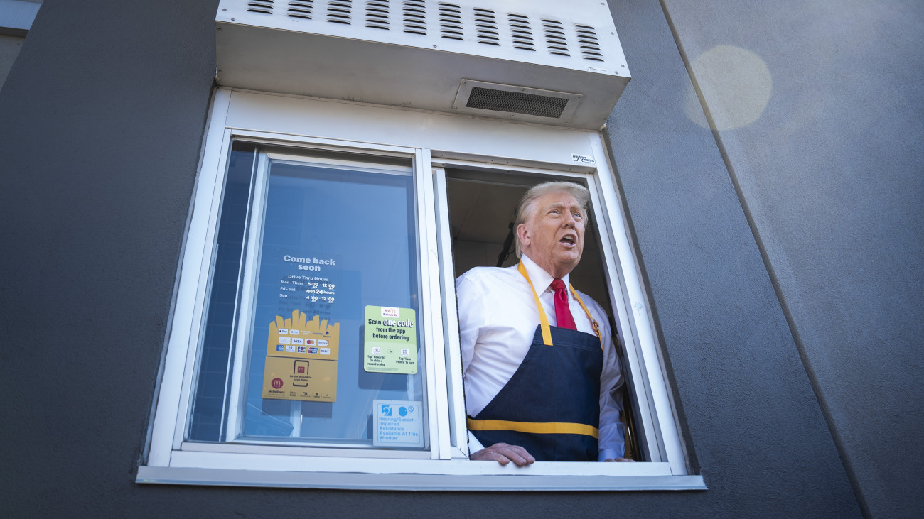 Feasterville-Trevose, PA - October 20 : Republican presidential nominee former President Donald Trump speaks to reporters after handing out food while standing at a drive-thru window during a campaign stop at a McDonalds in Feasterville-Trevose, PA on Sunday, Oct. 20, 2024.