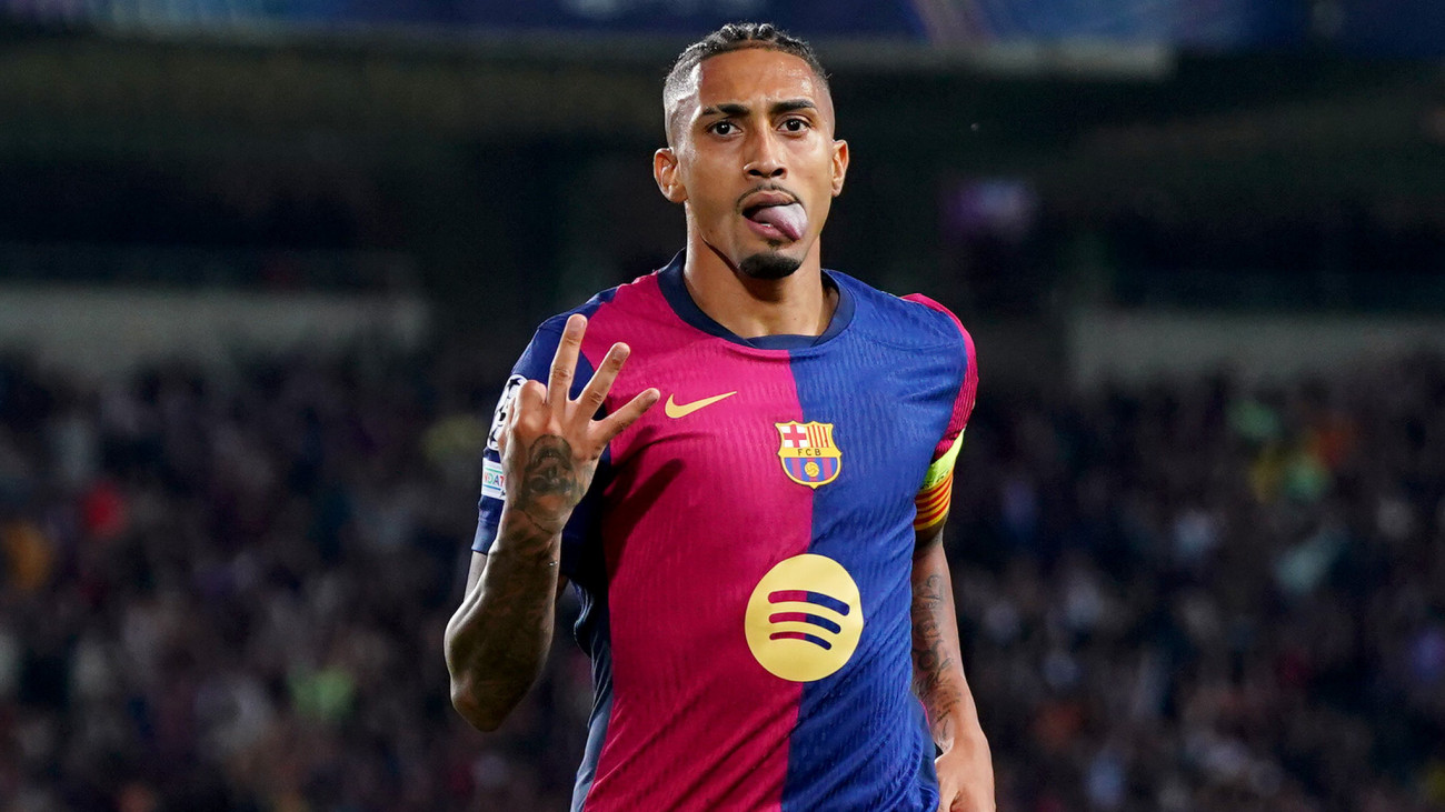 BARCELONA, SPAIN - OCTOBER 23: Raphinha of FC Barcelona celebrates scoring his teams fourth goal and his hat-trick goal during the UEFA Champions League 2024/25 League Phase MD3 match between FC Barcelona and FC Bayern Munchen at Estadi Olimpic Lluis Companys on October 23, 2024 in Barcelona, Spain. (Photo by Pedro Salado/Getty Images)