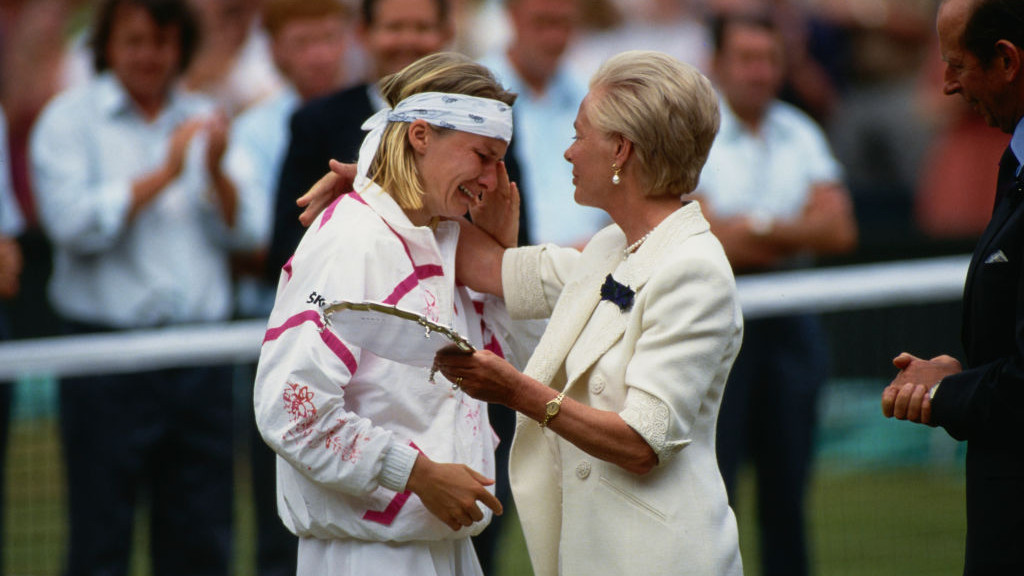 Czech tennis player Jana Novotna (1968-2017) is consoled by British Royal Katharine, Duchess of Kent after losing the womens singles final at the 1993 Wimbledon Championships, held at the All England Lawn Tennis and Croquet Club in London, England, 3rd July 1993. Novotna had been beaten by defending champion Steffi Graf, 7â6, 1â6, 6â4. (Photo by Henning Bangen/Bongarts/Getty Images)